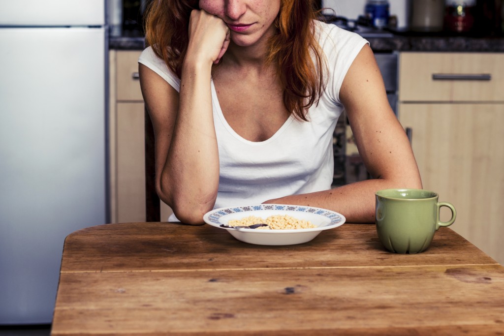 Young woman hates cereal