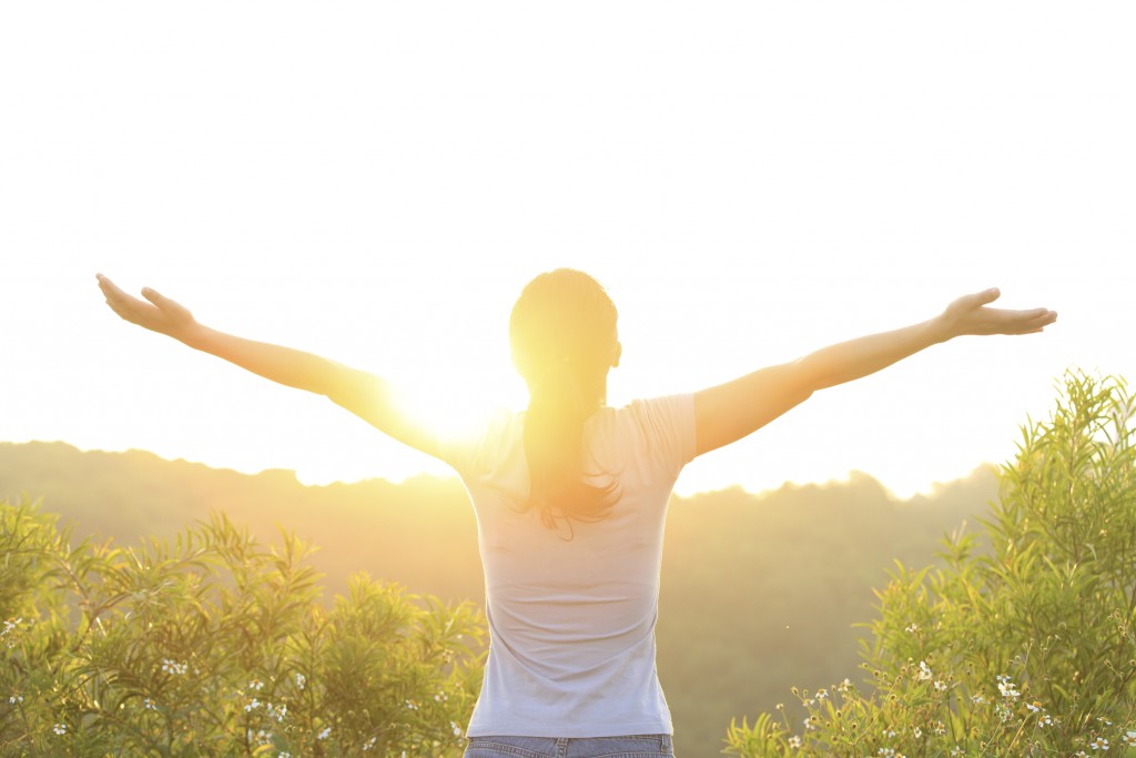 woman excited with sunrise